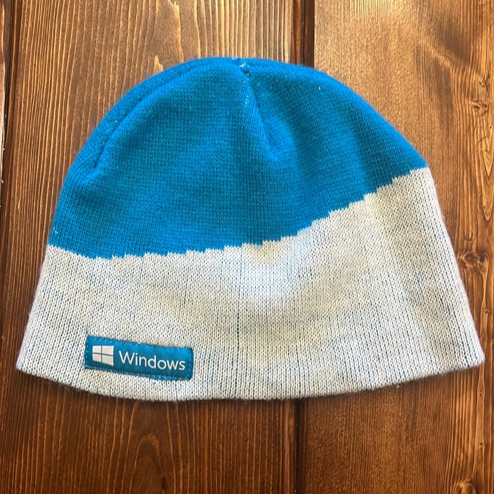 Windows beanie kind of cool small to medium head. Blue and white.